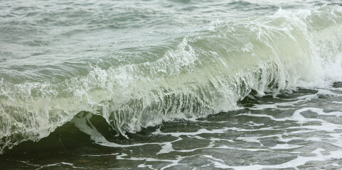 Wave in the sea with splashing water.