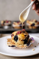 mixed berry low carb Keto Diet muffin with almond and nut. set on cafe table.