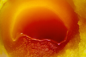 Abstraction formed by different texture and structure of honey. Fantastic background. Soft selective focus.
