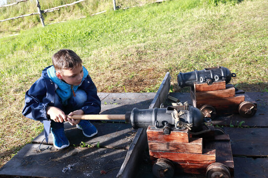 Child Loads Signal Ancient Cannon