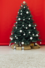 Christmas tree Christmas decoration interior of the red room with postcard gifts