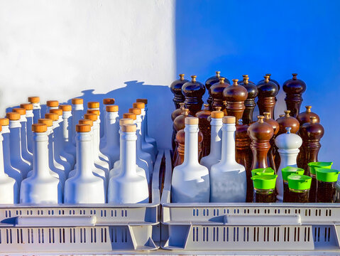 Season Salad Virgin Olive  Oil Dispensers. Close-Up.Greek virgin olive oil dispensers with pepper mill grinders and soya bottles grouped in a crate for restaurant use. Stock Image.