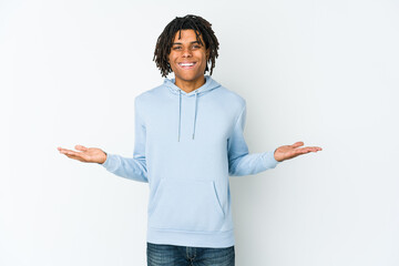 Young african american rasta man showing a welcome expression.