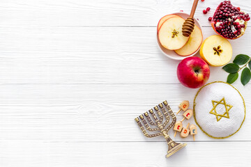 Jewish cuisine for rosh hashana holiday - apple honey and pomegranate, top view