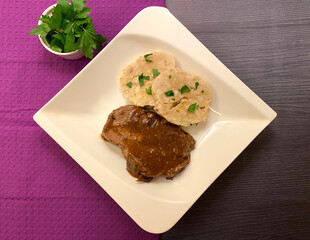 Classic dish. Tender and juicy pork roast with gravy and bread dumpling.