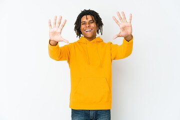 Young african american rasta man showing number ten with hands.