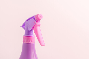spray nozzle on a bottle on a white background/purple spray nozzle on a bottle on a white background