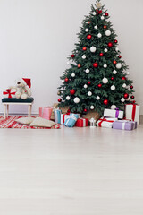 Christmas tree blue pine with gifts interior decor white room new year winter holiday