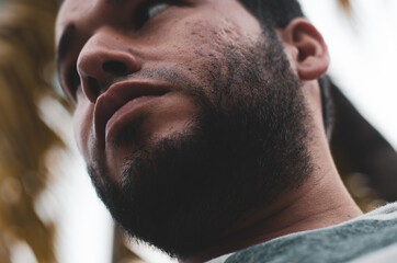 Fototapeta premium cute bearded latin man seen from below