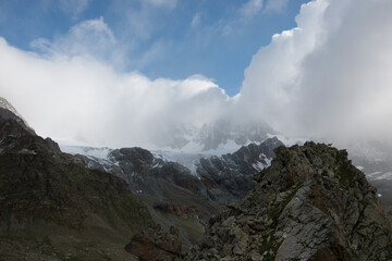 Mountain range with visible silhouettes through the morning fog