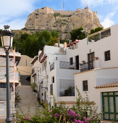 Fototapeta premium Santa Barbara Castle seen from the traditional district of Santa Cruz in the beautiful Mediterranean city of Alicante, Spain