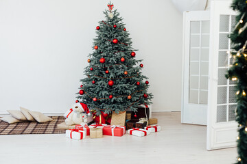 Christmas tree blue pine with gifts interior decor white room new year winter holiday