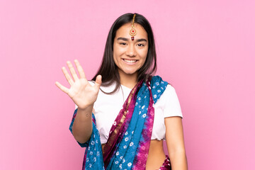 Young Indian woman with sari over isolated background counting five with fingers