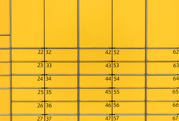 Post office box. Yellow post box for rentals.