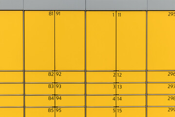 Post office box. Yellow post box for rentals.