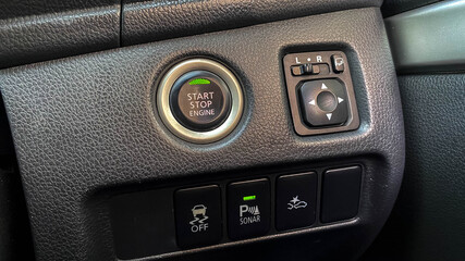 Close up engine car start button. Start stop engine modern new car button,Makes it easy to turn...