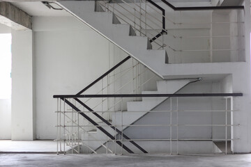 concrete stairs are wooden handrails. ladder in the building. Empty modern building stairway