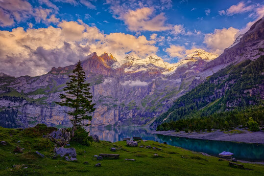 landscape in the mountains in late evening hours -  Breathtaking moments at Oschinensee Switzerland, watching reddish sunset slowly left the mountain peaks...