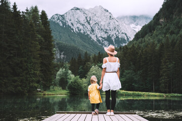 Mother and daughter together on nature. Family outdoor.