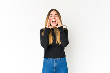 Young caucasian woman isolated on white background shouting excited to front.