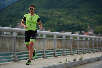 triathlon athlete running on street