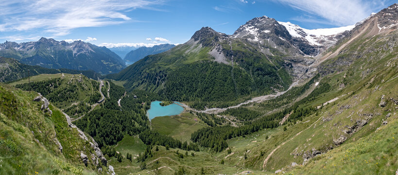 Panoramic view of Alpe Grum, Lake Palu, Lake Poschiavo, Lake Caralin in the Canton of Grisons, Switzerland