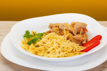 delicious pasta with cheese and stewed poultry turkey