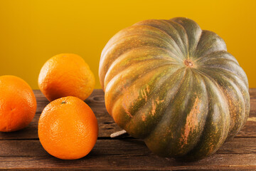 beautiful autumn pumpkin with delicious oranges