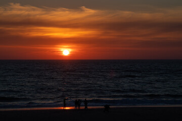 children enjoying the sunset on the beach, Portugal