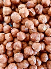 Hazelnut Background. Heap of peeled hazelnuts.