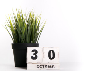 October 30, date on a wooden background