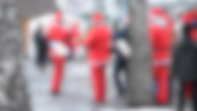 Blurred background. Orchestra of Santa Claus on street. The orchestra