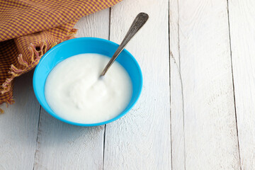 Natural yogurt in blue bowl