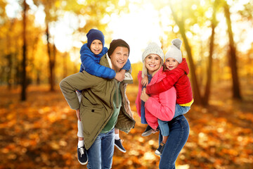 Fototapeta premium Happy family spending time together at autumn park