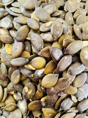 Macro background texture of green pumpkin seeds