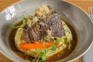 Braised beef cheek with mashed potato and carrot