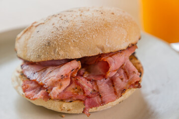 Bacon rashers in a toasted bun