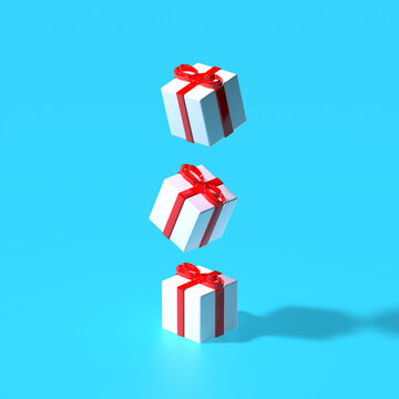 3d render. Xmas gift boxes flying above blue pastel background. Winter holidays concept. Surreal art.