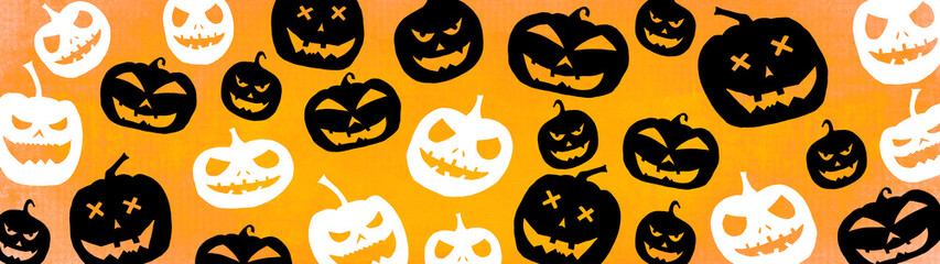 HALLOWEEN symbol background banner wide panoramic panorama template design -Top view Silhouette of scary carved luminous cartoon pumpkins isolated on dark orange yellow texture