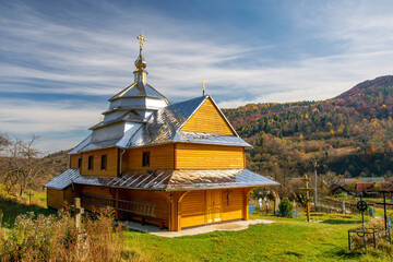 Obraz premium Scenic view of Greek Catholic wooden church of the Holy Trinity, Krushelnytsya, Lviv region, Ukraine