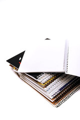 a lot of notebooks on a white background