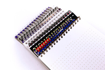 a lot of notebooks on a white background