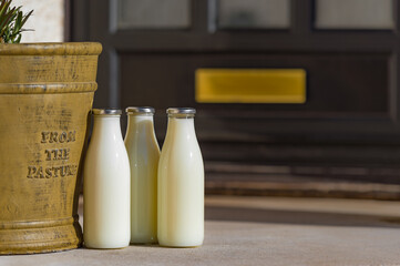 Bottles of fresh milk delivered to a doorstep