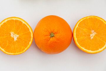 orange on a plate.  Fresh orange on white background. Top view 