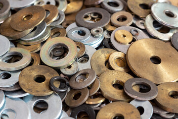 Steel and brass washers of various sizes and diameters.