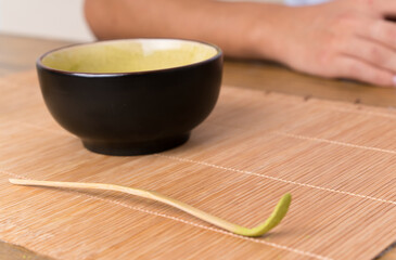 Young asian man with matcha tea in a table