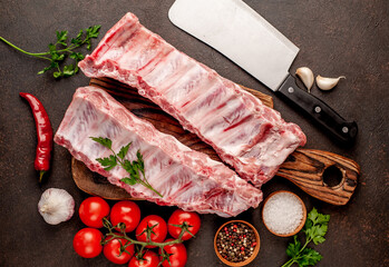  raw pork ribs on a stone background © александр таланцев
