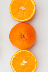 orange on a plate. Fresh orange on white background.  Top view 