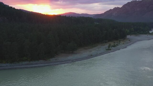 The mountain river view from high. Mountain landscapes. Pink sunset