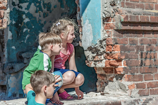 Three Children In A Destroyed House Are Hiding From Military Con